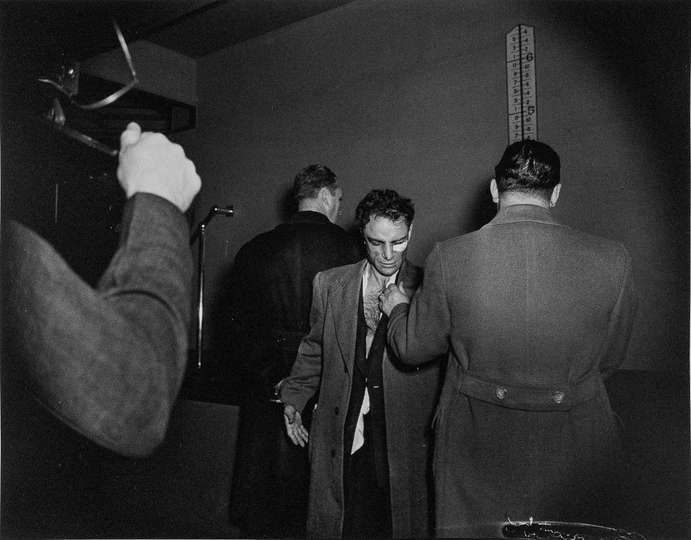 Anthony Esposito, fichado como sospechoso de haber asesinado a un policía, Nueva York, 16 de enero de 1941